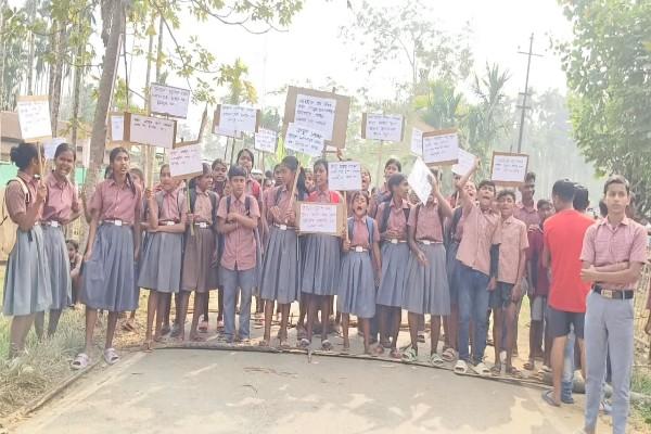 School students block road in Tripura protesting against teacher transfer